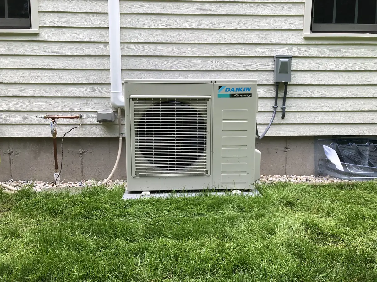 Daikin ductless mini split outdoor condenser installed by A.J. LeBlanc Heating at a Southern NH home