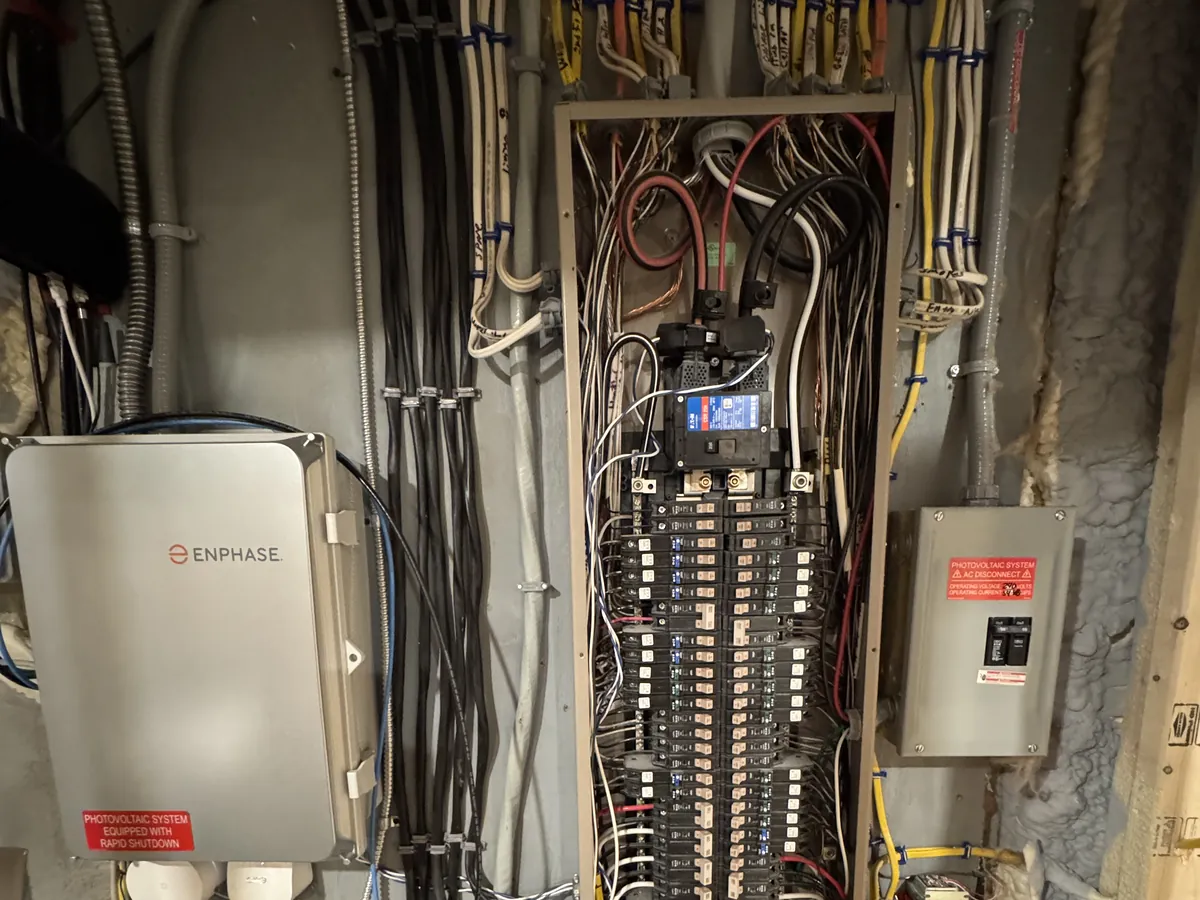Upgraded 200-amp electrical panel with Enphase microinverter solar integration installed by A.J. LeBlanc Heating in Southern NH