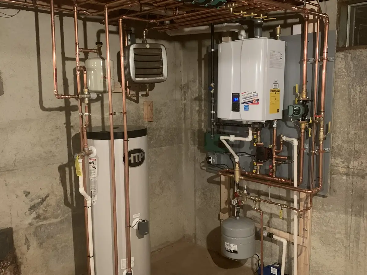 Navien wall-hung gas boiler with HTP SuperStor indirect water heater installation in Southern NH
