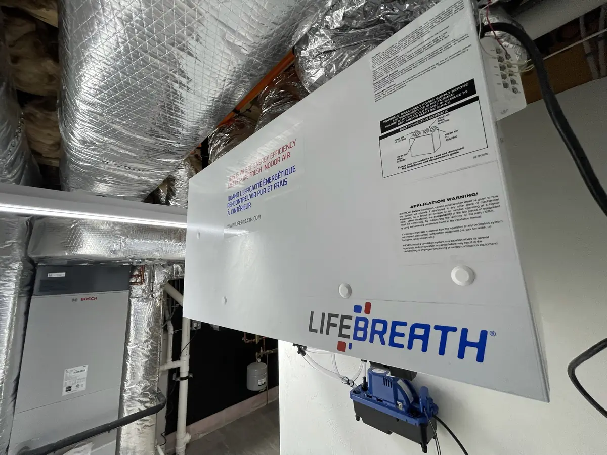 Lifebreath HRV ventilator installed in a Southern NH attic alongside a Bosch heat pump system by A.J. LeBlanc Heating