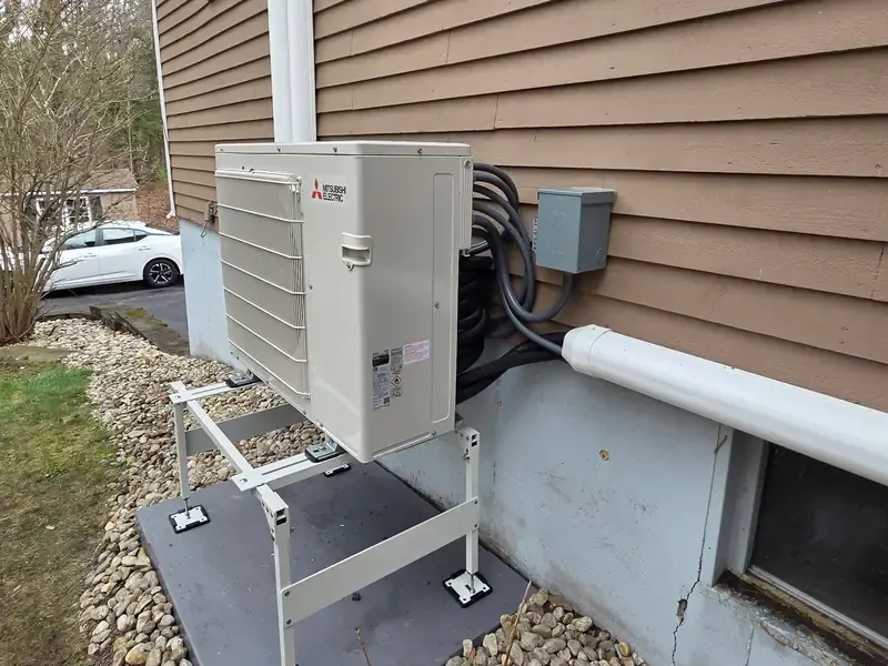 Mitsubishi outdoor mini split heat pump installed at a Southern NH home by A.J. LeBlanc Heating